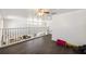 Spacious loft area with hardwood floors, wrought iron railing, and abundant natural light at 4301 Presidio Way, Kissimmee, FL 34746