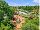 Playground featuring mature shade trees and lush landscaping at 4301 Presidio Way, Kissimmee, FL 34746