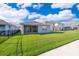 Large backyard with a covered patio, ideal for entertaining guests and enjoying outdoor living at 4479 Blue Rock Dr, Sanford, FL 32771