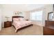Bedroom featuring carpet, a wood bed frame, and bright natural light at 4479 Blue Rock Dr, Sanford, FL 32771