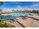 Resort-style community pool with plenty of lounge chairs for relaxation at 4479 Blue Rock Dr, Sanford, FL 32771