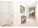 Inviting foyer with neutral tile flooring, a decorative table, and a glimpse of the bright, open living area at 4479 Blue Rock Dr, Sanford, FL 32771