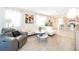 Bright living room featuring tile floors, white sofas, and an open floor plan at 4479 Blue Rock Dr, Sanford, FL 32771