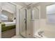 Bathroom showcasing a glass enclosed shower and a separate soaking tub at 4614 Falcon Ave, Kissimmee, FL 34746