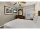 Spacious bedroom featuring a full-size bed, wood furnishings, and a ceiling fan at 4614 Falcon Ave, Kissimmee, FL 34746