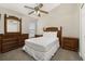 Bedroom showcasing wood furniture including a dresser and two nightstands at 4614 Falcon Ave, Kissimmee, FL 34746