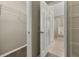 Walk-in closet leads to the bathroom with tile flooring at 4614 Falcon Ave, Kissimmee, FL 34746