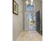 Bright foyer with tile flooring and a view of the front yard through a window at 4614 Falcon Ave, Kissimmee, FL 34746