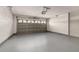 Spacious garage with overhead door and painted floor, ready for parking or storage at 4614 Falcon Ave, Kissimmee, FL 34746