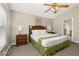 Serene main bedroom with a king bed and a view of the en-suite bathroom at 4614 Falcon Ave, Kissimmee, FL 34746
