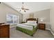 Relaxing main bedroom with a vaulted ceiling, ceiling fan, and a serene outdoor view at 4614 Falcon Ave, Kissimmee, FL 34746