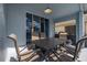 Inviting covered patio featuring a dining table with seating and a barbecue grill at 4614 Falcon Ave, Kissimmee, FL 34746