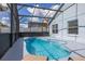 Sparkling screened-in pool with ample deck space, perfect for outdoor living and entertaining at 4614 Falcon Ave, Kissimmee, FL 34746