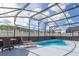 Sparkling pool surrounded by a screened enclosure for year-round enjoyment at 4614 Falcon Ave, Kissimmee, FL 34746