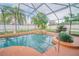 Inviting pool with lush tropical landscaping and screened enclosure at 4809 Jeanette Ct, St Cloud, FL 34771