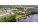 Aerial view of waterfront townhomes near community lake at 486 Lake Shore Pkwy, Davenport, FL 33896