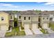 Aerial view of townhomes with lake views at 486 Lake Shore Pkwy, Davenport, FL 33896