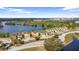 Scenic aerial view of lakefront townhomes, showcasing waterfront community with lush landscaping at 486 Lake Shore Pkwy, Davenport, FL 33896