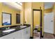 Bathroom features double vanity with black granite countertop, shower, and toilet at 486 Lake Shore Pkwy, Davenport, FL 33896