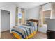 Bedroom features natural light, ceiling fan, and neutral carpeting at 486 Lake Shore Pkwy, Davenport, FL 33896