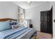 Bedroom features natural light, ceiling fan, and neutral carpeting at 486 Lake Shore Pkwy, Davenport, FL 33896