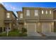 Charming townhome featuring an attached garage and well-maintained front yard at 486 Lake Shore Pkwy, Davenport, FL 33896