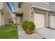 Attractive townhome featuring a cozy front entrance with a well-manicured garden at 486 Lake Shore Pkwy, Davenport, FL 33896