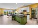 Open kitchen featuring an island and view to sunny dining room at 486 Lake Shore Pkwy, Davenport, FL 33896