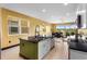 Bright kitchen featuring an island and eat-in dining space with sliding glass doors at 486 Lake Shore Pkwy, Davenport, FL 33896