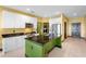 Bright kitchen features granite counters, stainless steel appliances, and a center island with a sink at 486 Lake Shore Pkwy, Davenport, FL 33896