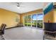Bright living area with a large sliding glass door showcasing tranquil lake views at 486 Lake Shore Pkwy, Davenport, FL 33896