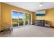 Open living space offers serene views of the lake through sliding glass doors at 486 Lake Shore Pkwy, Davenport, FL 33896