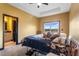 Main bedroom features a ceiling fan, a view of the water, and ensuite bathroom at 486 Lake Shore Pkwy, Davenport, FL 33896