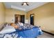 Main bedroom with ceiling fan, a closet, and ensuite bathroom at 486 Lake Shore Pkwy, Davenport, FL 33896