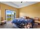 Bedroom with a serene lake view from the sliding glass door and small balcony at 486 Lake Shore Pkwy, Davenport, FL 33896
