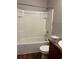 Bathroom includes a shower with full tiling at 49 Inconnu Dr, Poinciana, FL 34759