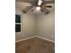 Bedroom featuring a ceiling fan, a window, and neutral wall color at 49 Inconnu Dr, Poinciana, FL 34759