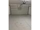 The garage has ample space with a clean floor at 49 Inconnu Dr, Poinciana, FL 34759