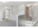 Upper-level landing featuring neutral carpet, fresh paint and natural light at 49 Inconnu Dr, Poinciana, FL 34759