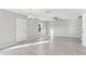 Bright and airy living room featuring modern flooring and neutral wall colors at 49 Inconnu Dr, Poinciana, FL 34759