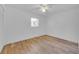Bright bedroom with new vinyl floors, a ceiling fan, and neutral paint at 495 Orange Ave, St Cloud, FL 34769