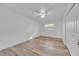 Bright bedroom with new vinyl floors, a ceiling fan, and a closet at 495 Orange Ave, St Cloud, FL 34769