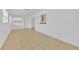 Bright living room featuring tile flooring, white walls, and a large window for natural light at 495 Orange Ave, St Cloud, FL 34769