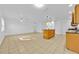 Spacious living room with open floor plan, tile flooring, and easy access to the kitchen area at 495 Orange Ave, St Cloud, FL 34769