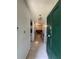 A welcoming foyer with tiled floors, chandelier lighting, and views of the living area and kitchen at 502 Polaris Loop # 110, Casselberry, FL 32707
