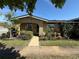 Inviting single-story home featuring verdant landscaping and a welcoming pathway at 502 Polaris Loop # 110, Casselberry, FL 32707