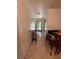 Hallway featuring tiled floors, chandelier lighting and access to various rooms in the home at 502 Polaris Loop # 110, Casselberry, FL 32707