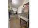 Functional utility space featuring shelving, water heater, and HVAC system for efficient home maintenance at 502 Polaris Loop # 110, Casselberry, FL 32707