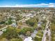 Scenic aerial view showcasing the neighborhood's layout, featuring lush trees and quiet streets at 521 Florida Ave, St Cloud, FL 34769