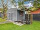 Home's backyard shows a shed and patio at 521 Florida Ave, St Cloud, FL 34769
